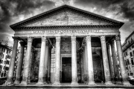 Building With 8 Concrete Pillar in Front Grayscale Photo