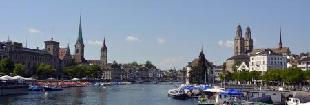 Buildings Near Lake With Boats during Daytime