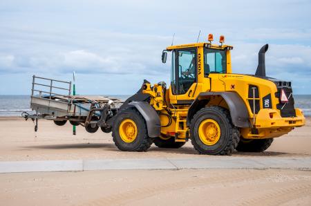 Bulldozer tractor working on a beach