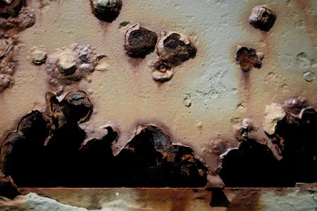 Bullet holes in metal