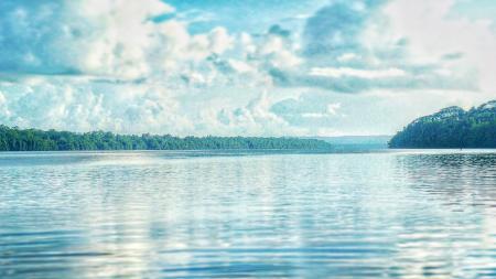 Calm Lake Under Cloudy Sky