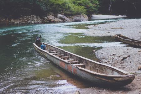 Canoe on Muddy Riverbank