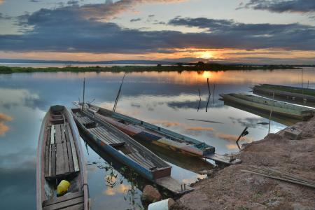 Canoe on Seashore during Sunset