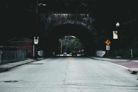 Cars on Road Under Tunnel during Daytime