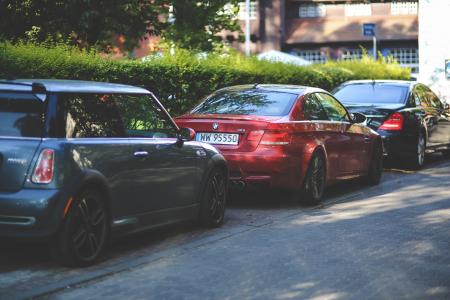 Cars parked along way