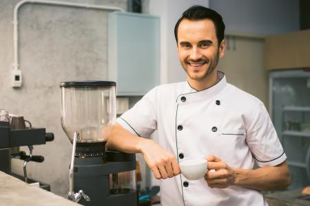 Chef Holding White Tea Cup