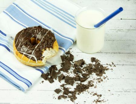 Chocolate Donut Beside Chunked Chocolates