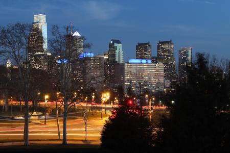City Buildings Near the Road Beside Trees