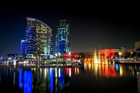 City Skyline Beside Water during Night