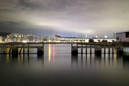 Cityscape View over Sea With Lights Turned on during Night