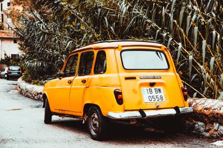 Classic Yellow Car on Side of Road at Day