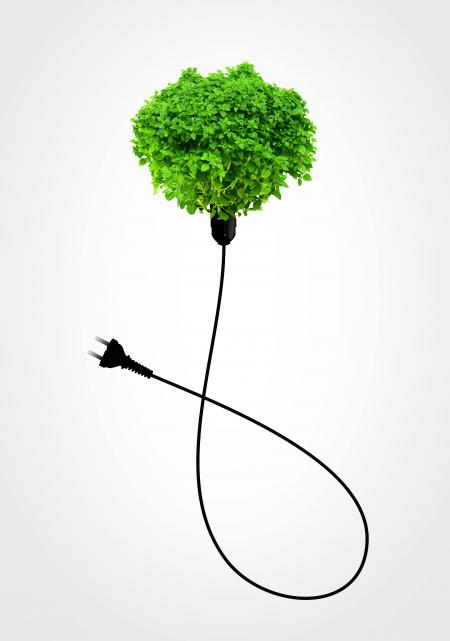 Clean Energy Concept - A Green Power Plug on White
