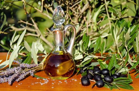 Clear Glass Bottle on Brown Wooden Table Top