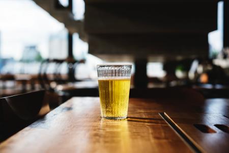 Clear Glass Filled With Yellow Liquid