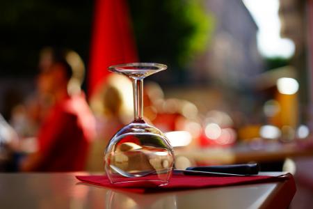 Clear Wine Glass on Top of Brown Table