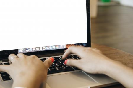 Close-up of Man Using Laptop