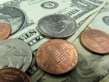 Close-up of US dollars and coins