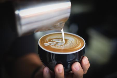 Close-up of Woman Holding Coffee Cup at Cafe