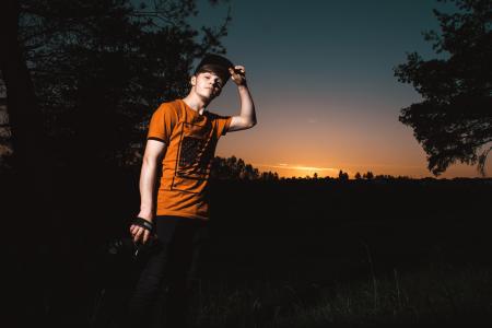 Close-up Photo of a Man Wearing Orange Shirt