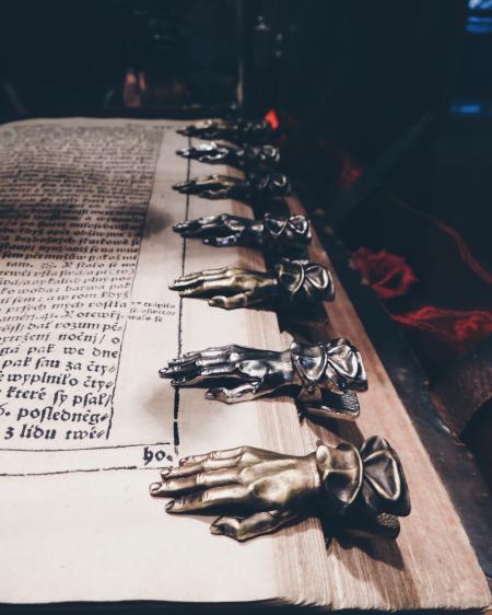 Close Up Photo of Black and Brown Metal Hand Book Mark