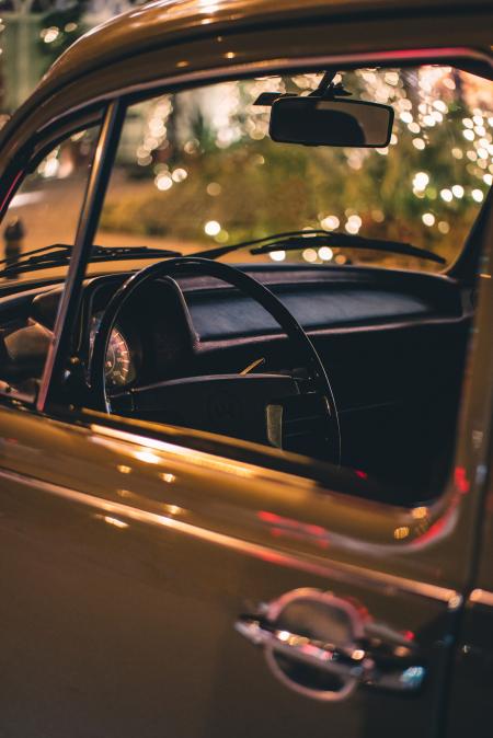 Close Up Photo of Vehicle Steering Wheel and Door