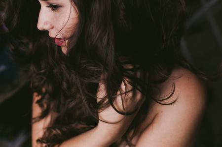 Close-Up Photography of a Woman Holding Her Hair