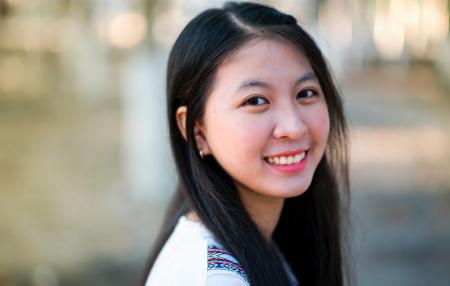 Close-Up Photography of a Woman Smiling