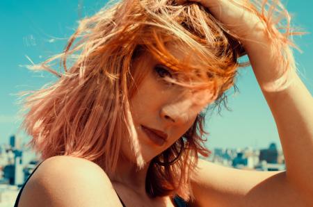 Close-up Photography of a Woman Touching Her Hair