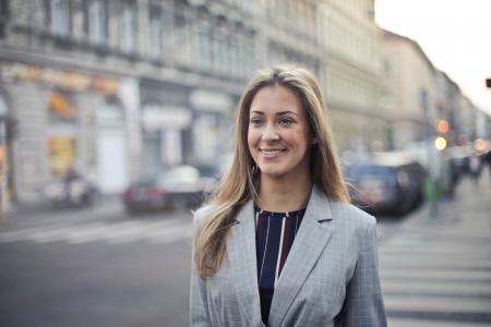 Close-up Photography of a Woman Wearing Formal Coat