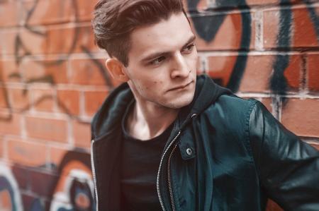 Close-up Photography of Man Wearing Leather Jacket