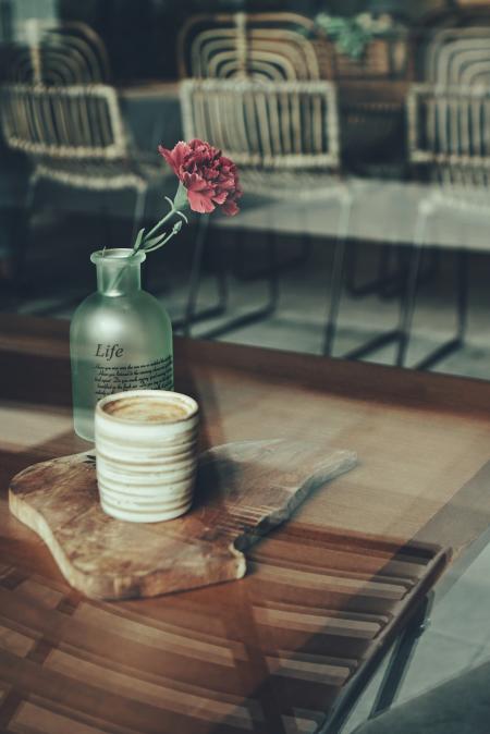 Close-up Photography of Mug and Flower Vase