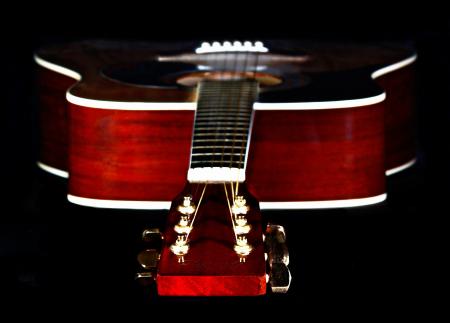 Close Up Photography of Red Wooden Guitar Head Stock