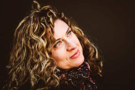 Close-Up Photography of Woman Wearing Red and Black Scarf