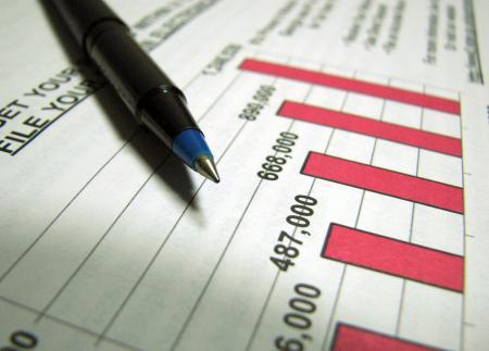 Closeup of a tax income graph and pen