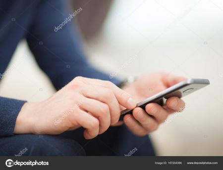 Close-up of Man Using Mobile Phone