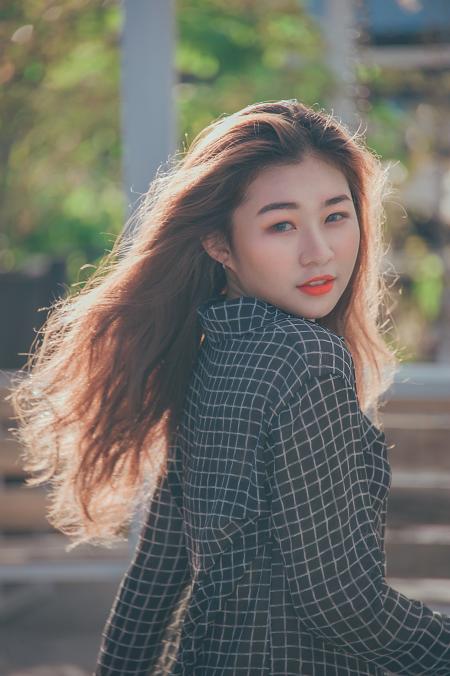 Closeup Photo of a Woman Wearing Black and White Plaid Blazer