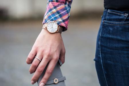 Closeup Photo of Person Wearing Round Gold-colored Framed Analog Watch