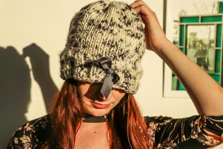 Closeup Photo of Woman Wearing White and Black Knit Cap