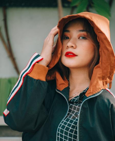 Closeup Photography of Woman Wearing Black and Brown Zip-up Hoodie