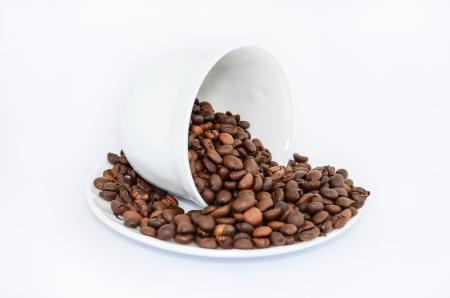 Coffee Beans on White Ceramic Saucer