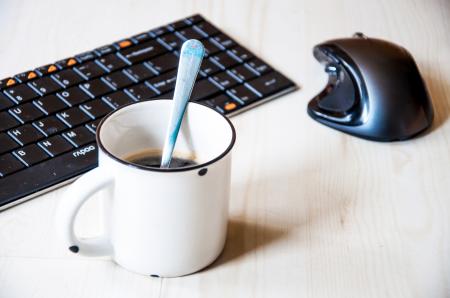 Coffee cup and office supplies