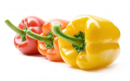 Colorful bell peppers isolated on white
