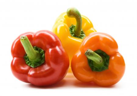 Colorful bell peppers isolated on white