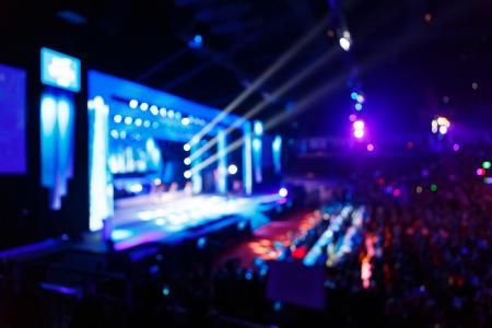 Concert crowd in front of bright stage