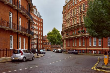 Concrete Road Near Side-by-side Building With Vehicles