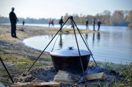 Cooking food in nature against the backdrop of the river