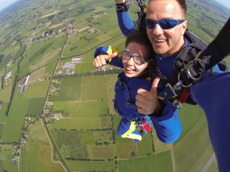 Couple in Blue Suit Paragliding
