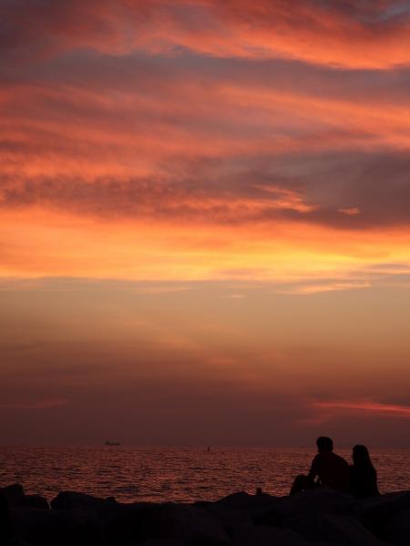 Couple Sit and Watch the Sunset