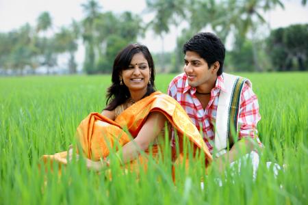Couple sitting in a paddy field