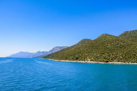 Croatian coastline with blue water and hills